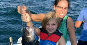 Read more about the article Hooked on Fun: Kids’ Fishing Adventures Aboard the Sorry Charlie